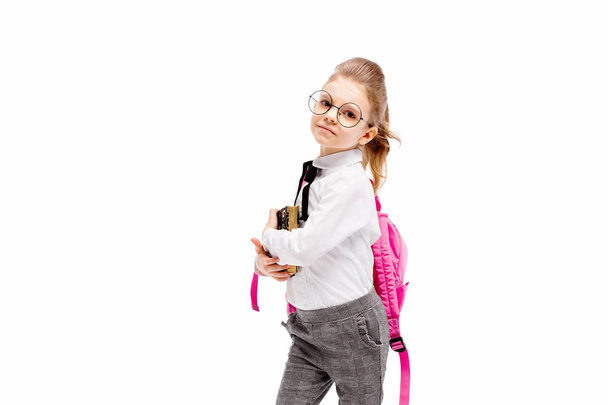Child with schoolbag. Girl with pink school bag isolated on whit - Zdjęcie, obraz