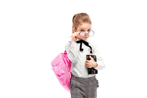 Child with schoolbag. Girl with pink school bag isolated on whit - Fotografie, Obrázek