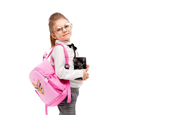 Child with schoolbag. Girl with pink school bag isolated on whit - Fotó, kép