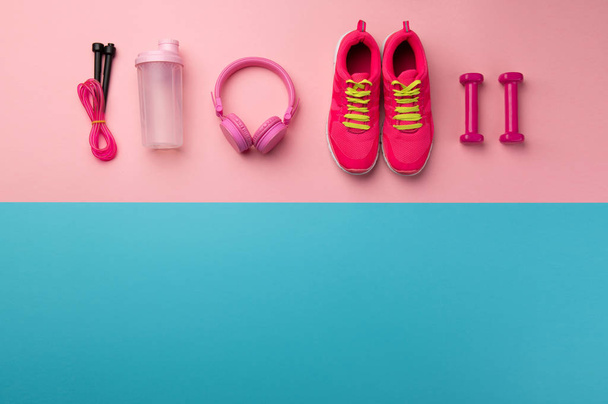 A studio shot of running shoes and other sport equipment on color background. - 写真・画像