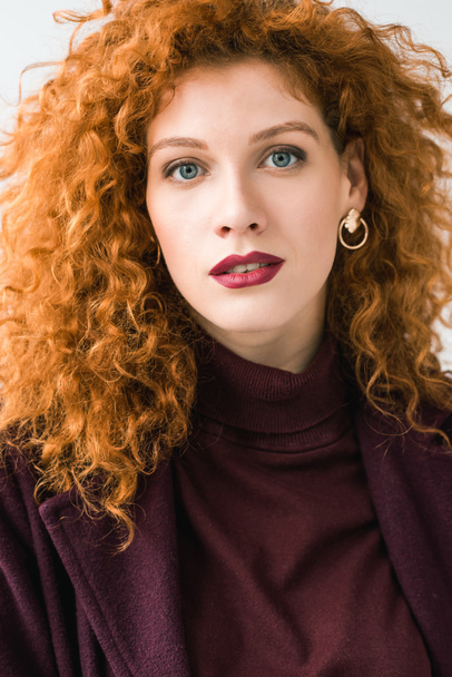 attractive curly redhead woman looking at camera isolated on white  - Фото, зображення