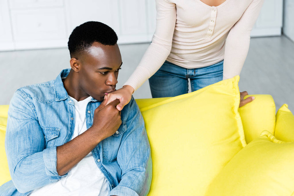 african american man kissing hand of girlfriend at home - Photo, image