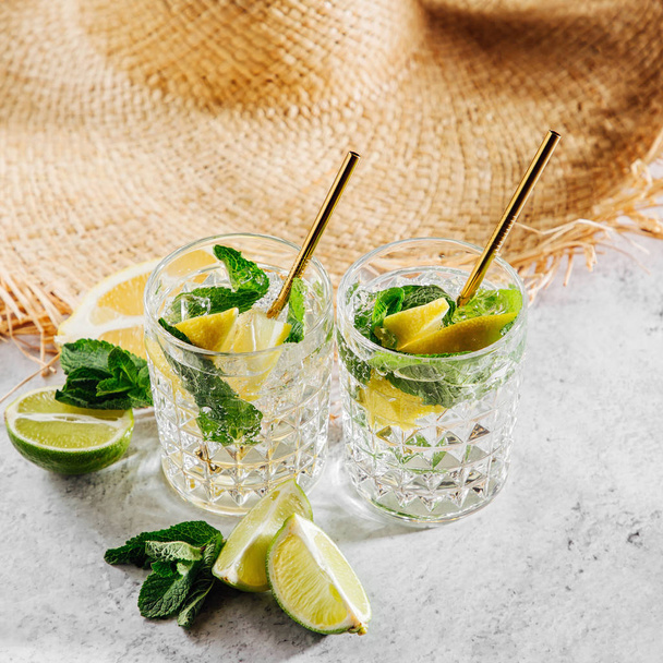 Fresh citrus lemonade with limes, lemons and mint. Summer drinks.  - Fotografie, Obrázek