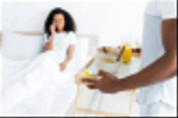 selective focus of african american man holding try with breakfast, on smiling girlfriend background - Fotografie, Obrázek