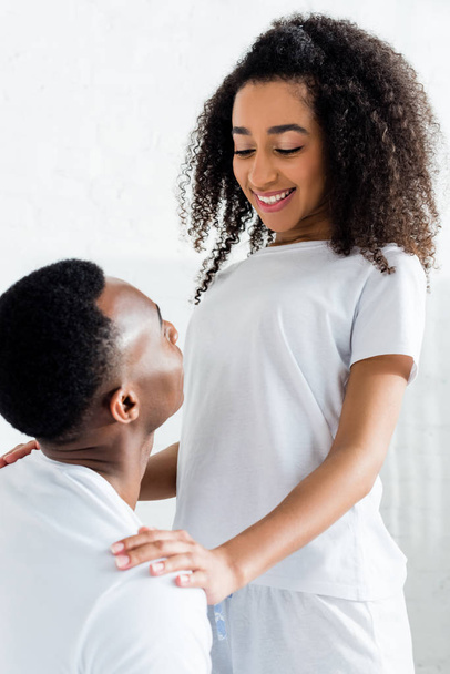 beautiful african american woman putting hands on boyfriend - Valokuva, kuva