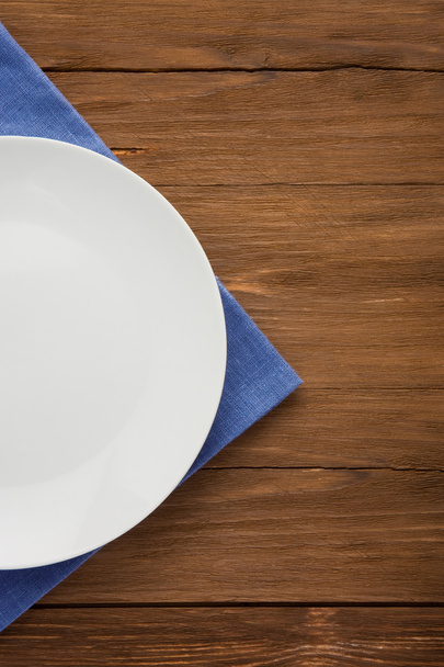 plate at napkin on wood - 写真・画像
