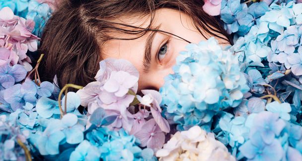 Summer beauty. Spring woman with hydrangea flowers. Fashion portrait of woman. Healthy hair and skin. Makeup cosmetics and skincare. girl with summer makeup. You are so beautiful - Foto, Imagem