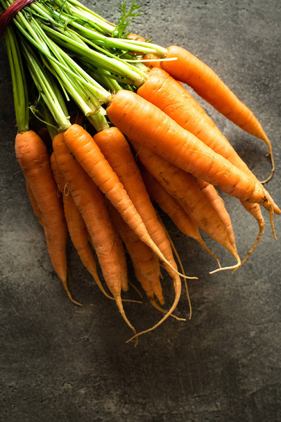 Nantes Carrots on Rustic Dark Background - Photo, Image