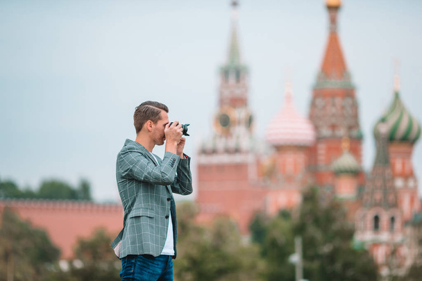 Professional photographer man taking a city photo - Fotografie, Obrázek