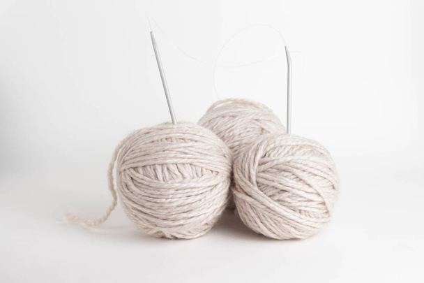 tree beige kniting balls of wool on white background - Photo, Image