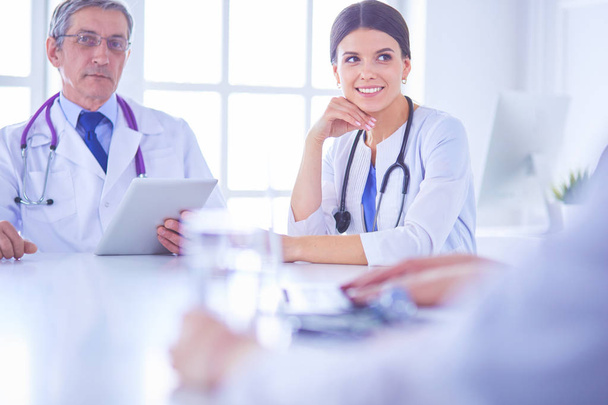 Doctors consulting with each other in a hospital conference room - Photo, Image