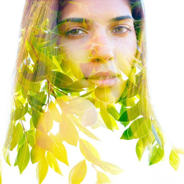 Double exposure portrait of a young natural beauty combined with - Foto, immagini