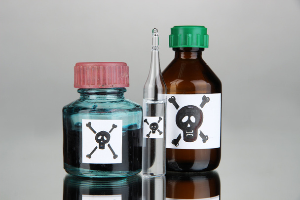 Deadly poison in bottles on grey background - Foto, Imagem