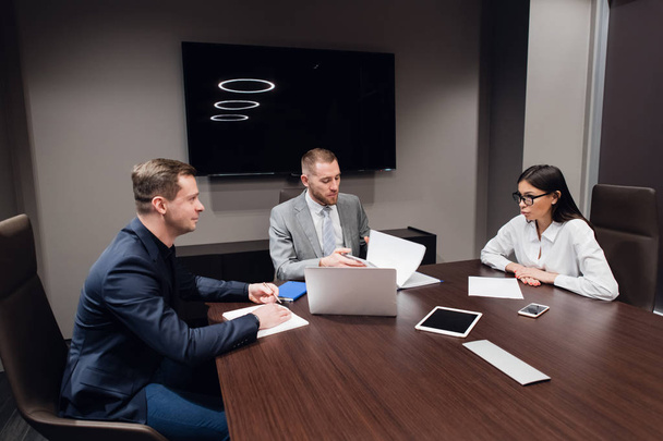 Coworkers meeting at conference room to discuss project in office - Photo, Image
