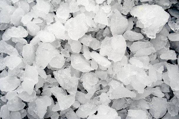 Pile of crushed ice on black stone background  - Fotó, kép
