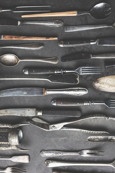 Vintage utensils on dark textured background, top view - Foto, Bild