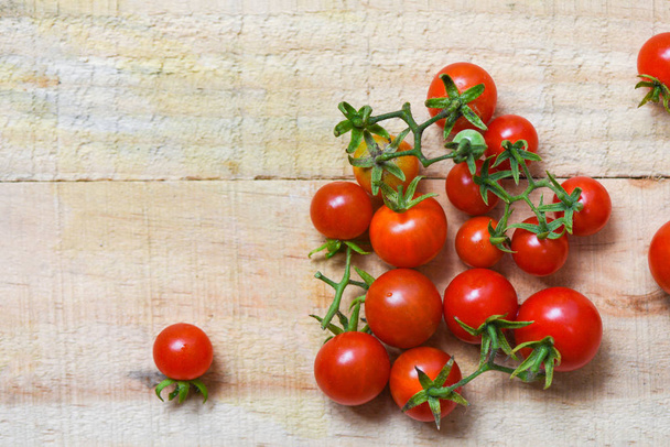 Tomato organic - Ripe red tomatoes on wooden background  - Photo, Image