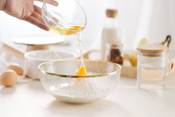fresh eggs milk and flour on white table - 写真・画像