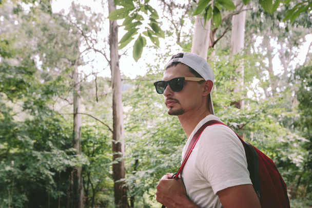 man with backpack walking in the forest - Foto, Imagem