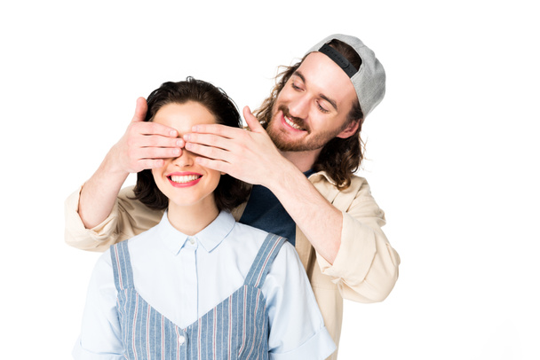 young man closing eyes to girl, who smiling with joy isolated on white - Φωτογραφία, εικόνα