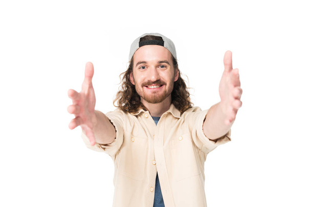 jonge man met uitgestrekte handen geïsoleerd op wit - Foto, afbeelding