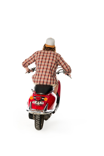 back view of young man sitting on red scooter isolated on white - Foto, Bild