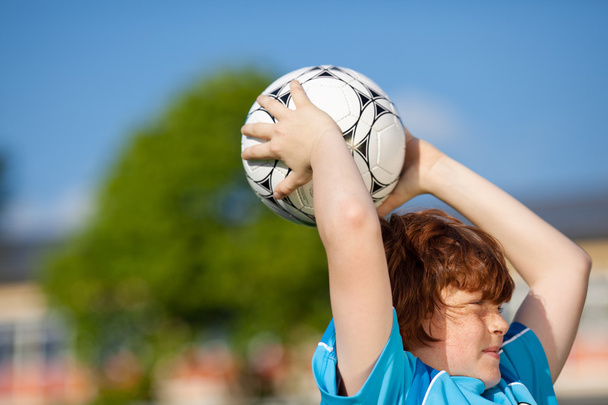young soccer player throwing in - Φωτογραφία, εικόνα