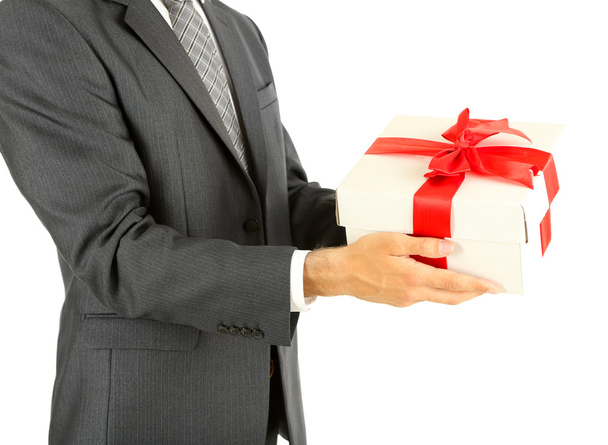 Young businessman present gift box, isolated on white - 写真・画像