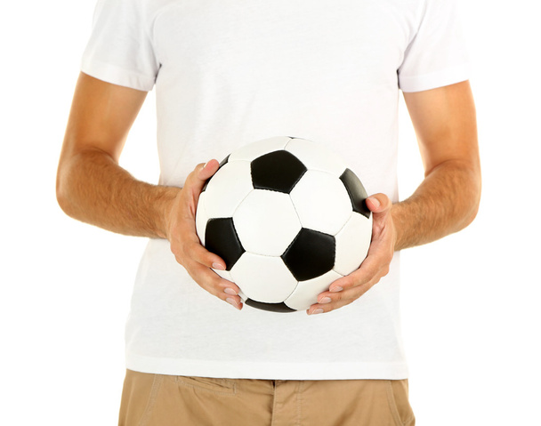 Young soccer player holding ball, isolated on white - Foto, afbeelding