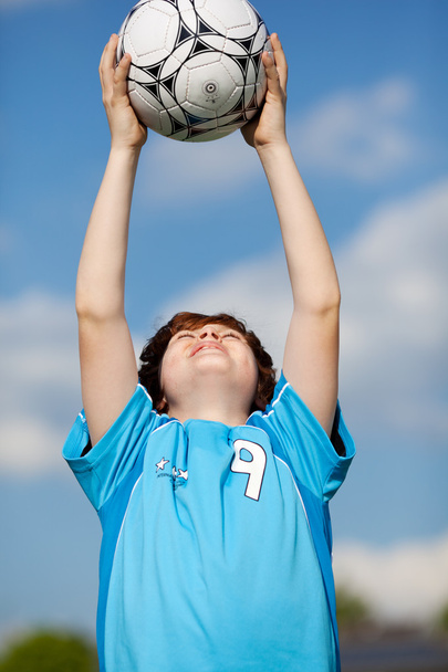 Boy Catching Soccer Ball - Fotografie, Obrázek