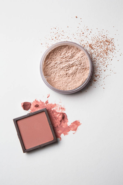 Blusher and facial powder on light background - Foto, afbeelding