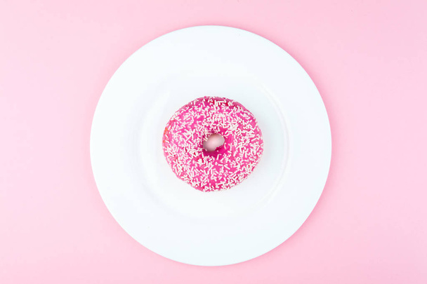 Pink round donut at bright pink background - Foto, Imagem