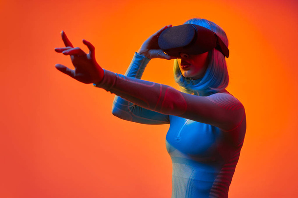 Futuristic lady interacting with virtual reality - Photo, Image