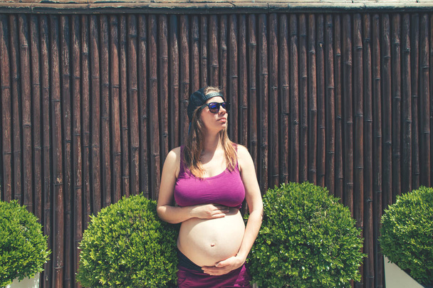Pregnant woman outdoor. - Photo, image