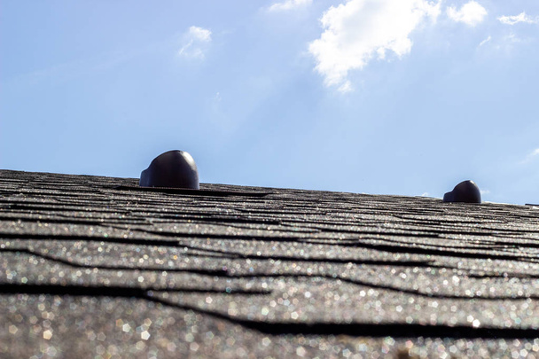 The roof of the house. Tile. Construction of houses. Chimneys. - 写真・画像