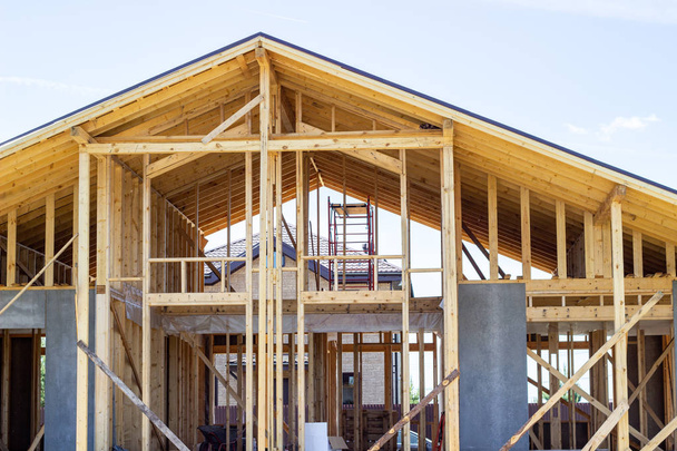 Construction of a wooden house. Beam. Blue Sky. Architecture. - Photo, Image