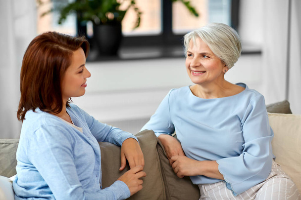 senior mother talking to adult daughter at home - Photo, image
