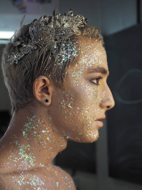 Young boy model at the art make-up as golden caesar view from th - Photo, Image