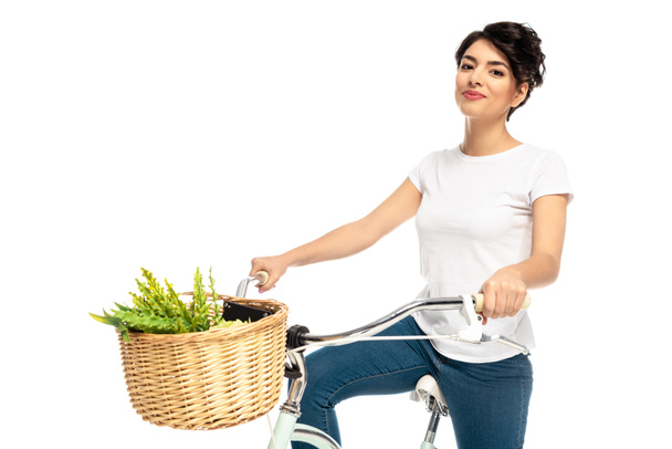 latin heureux femme équitation vélo et sourire isolé sur blanc
  - Photo, image