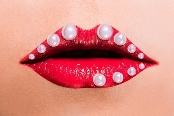 Beautiful red female lips with pearls - Φωτογραφία, εικόνα
