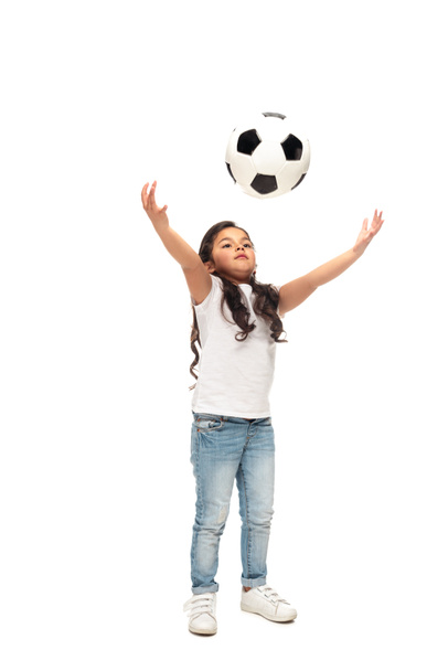 cheerful latin kid playing with soccer ball isolated on white  - Fotoğraf, Görsel