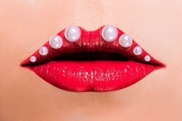 Beautiful red female lips with pearls - Φωτογραφία, εικόνα