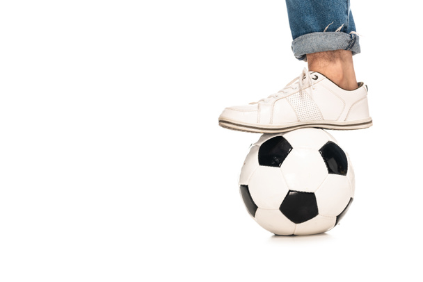 cropped view of man standing near soccer ball isolated on white  - Фото, зображення