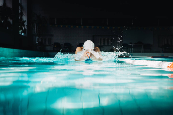 Professional woman swimmer swim using breaststroke technique on  - Foto, Bild