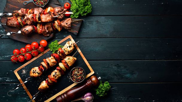 Kebab. Baked meat with onions and tomatoes. Barbecue. Top view. Free space for your text. Rustic style. - Fotoğraf, Görsel