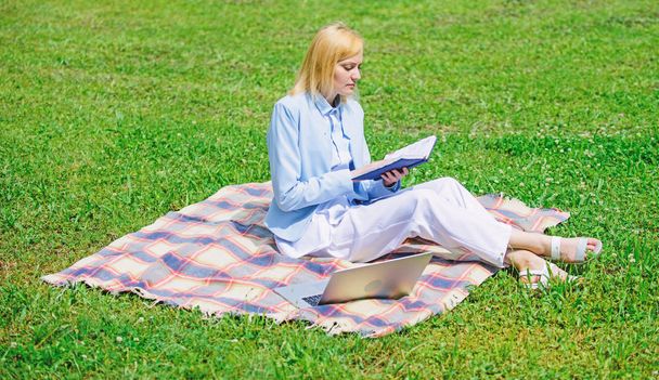 Online business ideas concept. Business picnic concept. Woman with laptop or notebook sit on rug green grass meadow. Steps to start freelancing business. Business lady freelancer work outdoors - Φωτογραφία, εικόνα
