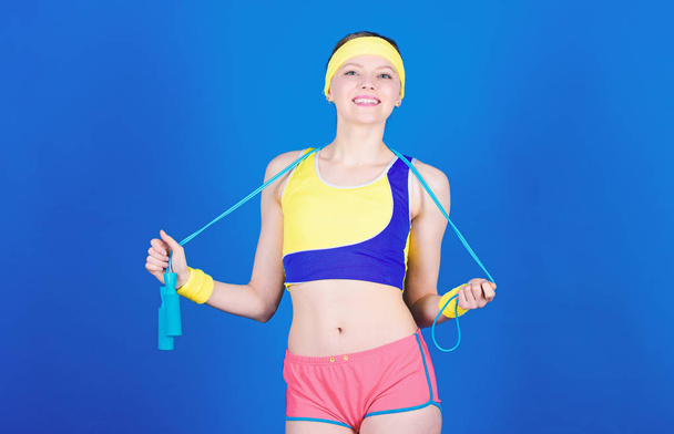 Fit body. Sport skipping rope equipment. Athletic fitness. Happy woman workout with jump rope. Strong muscles and power. Sporty woman training in gym, fit. Health diet. Success. Fit and healthy - Foto, afbeelding