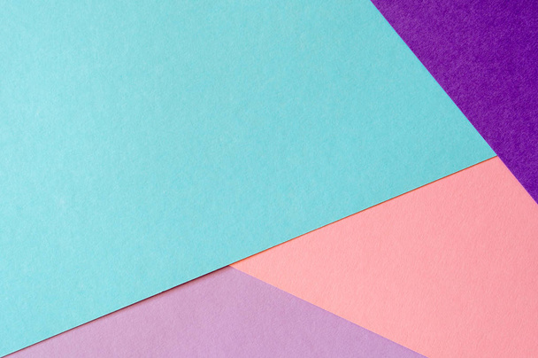 Multicolored paper background in soft blue, violet, lilac and coral colors. - Photo, image