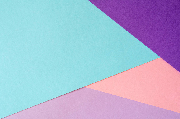 Multicolored paper background in soft blue, violet, lilac and coral colors. - Photo, image