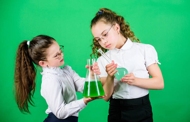 Chemistry lesson. Having fun with chemistry. Educative experiment. Chemistry fun. Knowledge day. Schoolgirl with colorful chemical liquids. Education concept. Safety measures. Small kid study - Photo, image